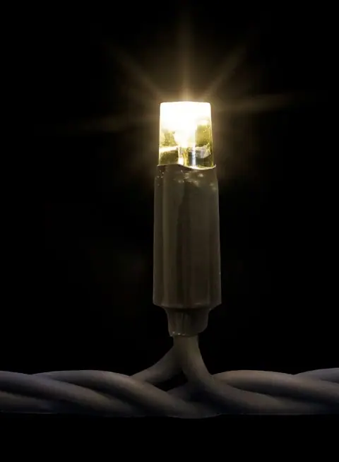 Siyah fonda koyu gövdeli, parlak uçlu sıcak beyaz tek LED lamba