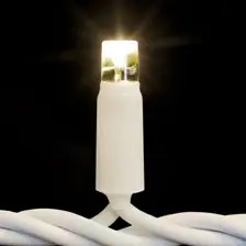 Siyah fonda krem gövdeli, beyaz kablolu sıcak beyaz LED lamba