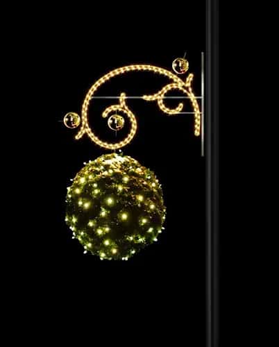 Siyah fonda konsol kıvrımlı altın motif, altında yeşil ışıklı küre